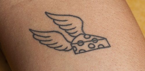 Tatto holed cheese with wings